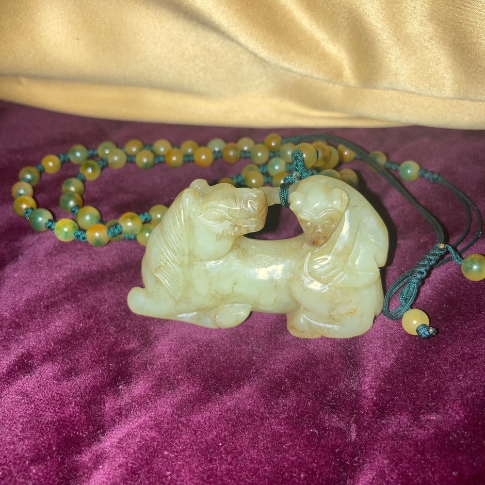 Chinese jade carving of a reclining horse with a monkey on it's back, see video